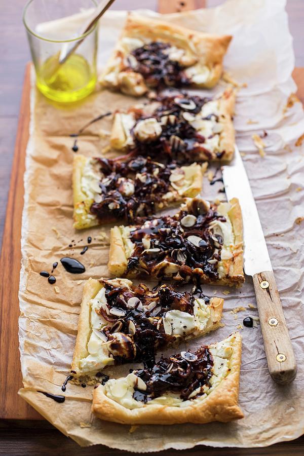 Puff Pastry Pizza With Goats Cheese, Caramelised Balsamic Onions And Almonds Photograph by Sandra Krimshandl-tauscher