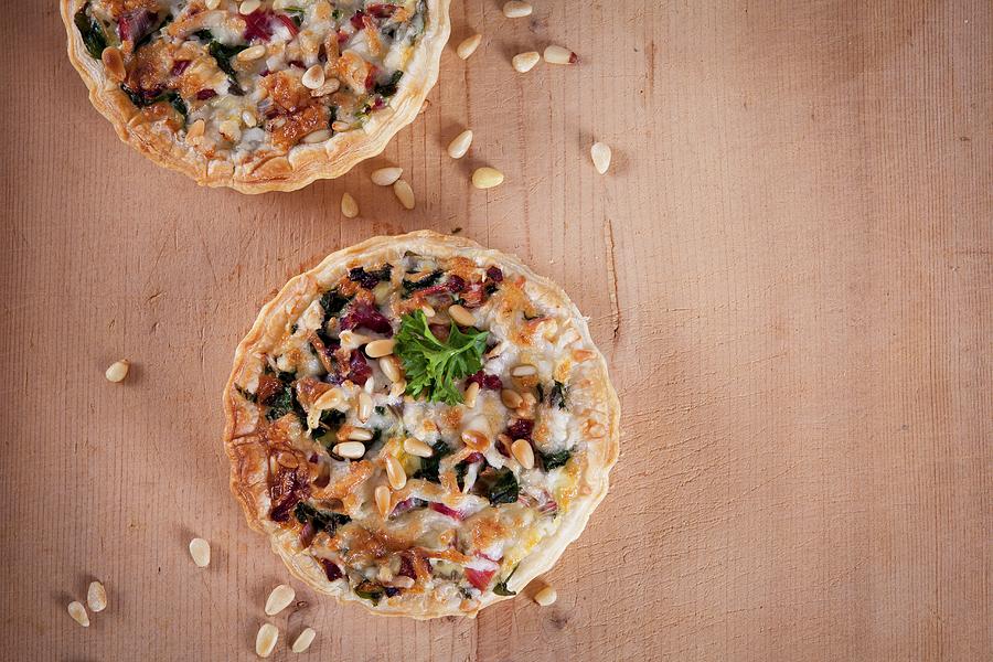 Puff Pastry Quiche With Chard, Bacon, Goats Cheese And Pine Nuts Photograph by Elisabeth Von Plnitz-eisfeld