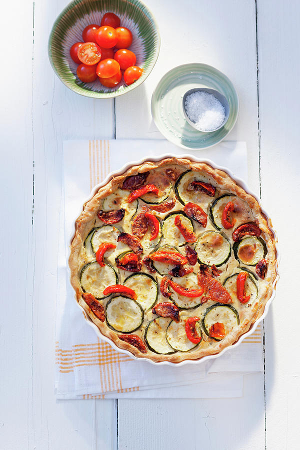 Puff Pastry Quiche With Courgette, Sun-dried Tomatoes And Cream Cheese Photograph by Peter Kooijman