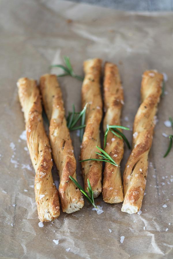 Puff Pastry Sticks With Salt And Rosemary Photograph by Jan Wischnewski