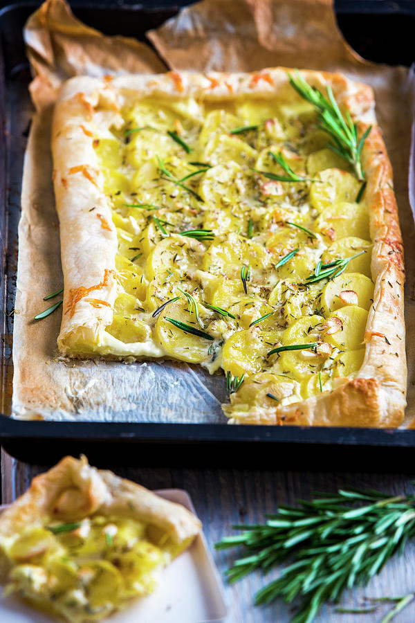 Puff Pastry Tart With Mascarpone, Potatoes, Rosemary, Garlic And Cheese Photograph by Sandra Krimshandl-tauscher