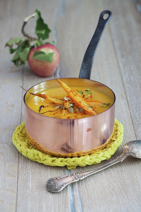 Pumpkin And Apple Soup With Roasted Carrots And Pumpkin Seeds Photograph by Yelena Strokin
