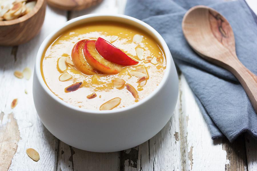 Pumpkin And Carrot Soup With Caramelised Apples And Almonds Photograph by Vivi Dangelo