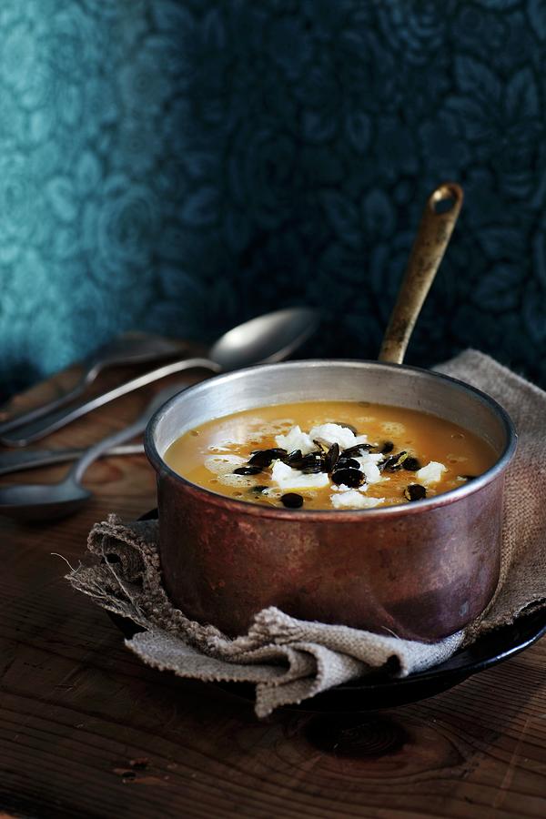Pumpkin And Parsnip Soup With Sheeps Cheese And Roasted Pumpkin Seeds Photograph by Ulrika Ekblom