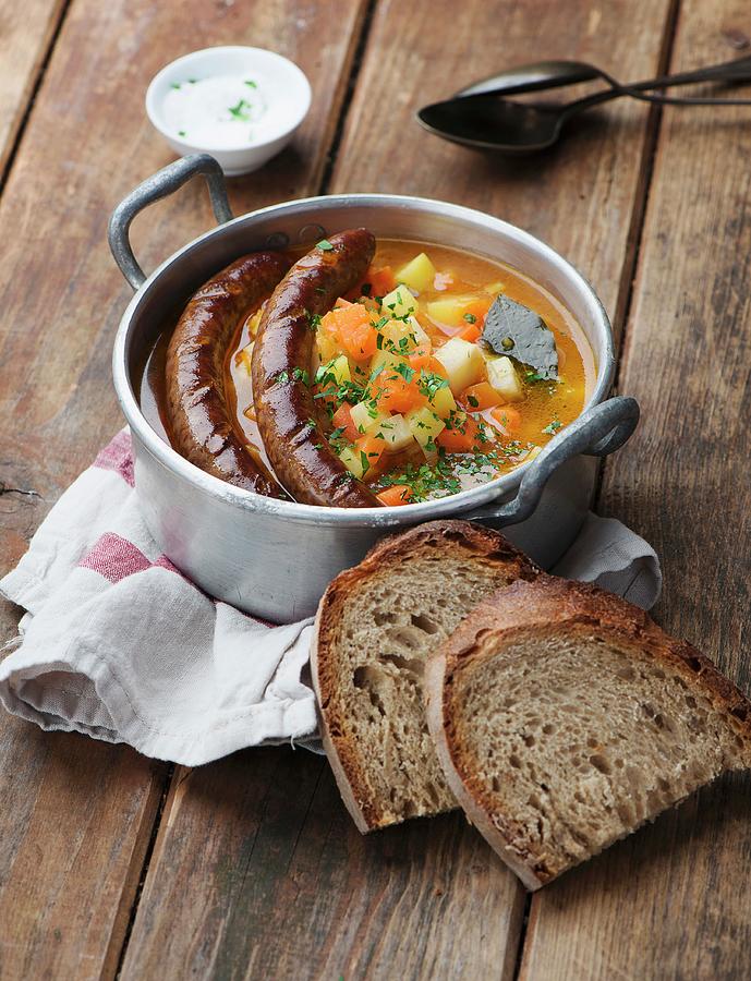 Pumpkin And Potato Soup With Sausage Photograph by Ewgenija Schall