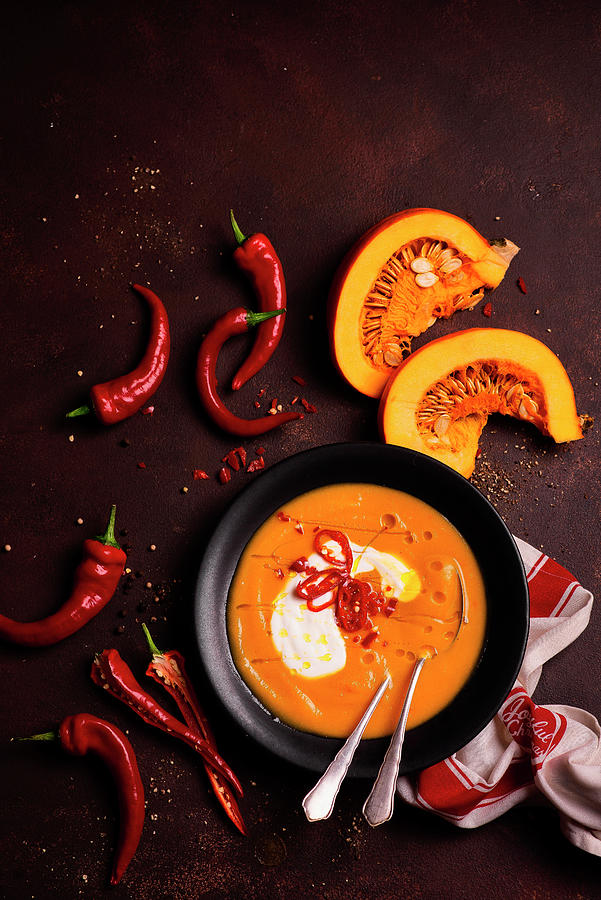 Pumpkin Cream Soup With Chilli Photograph by Karolina Polkowska