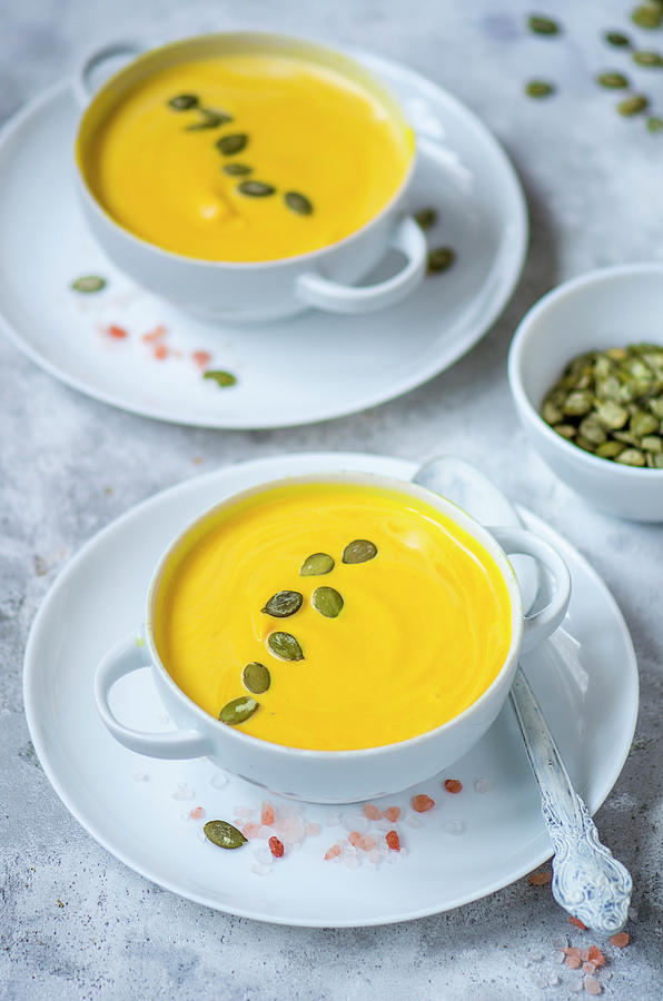Pumpkin Cream Soup With Pumpkin Seeds Photograph by Gorobina