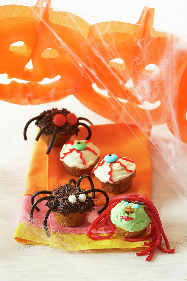 Pumpkin Cupcakes For Halloween Photograph by Sven C. Raben