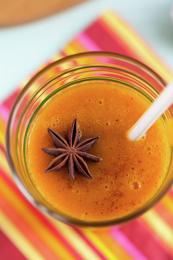 Pumpkin Juice With Star Anise Photograph by Nandita