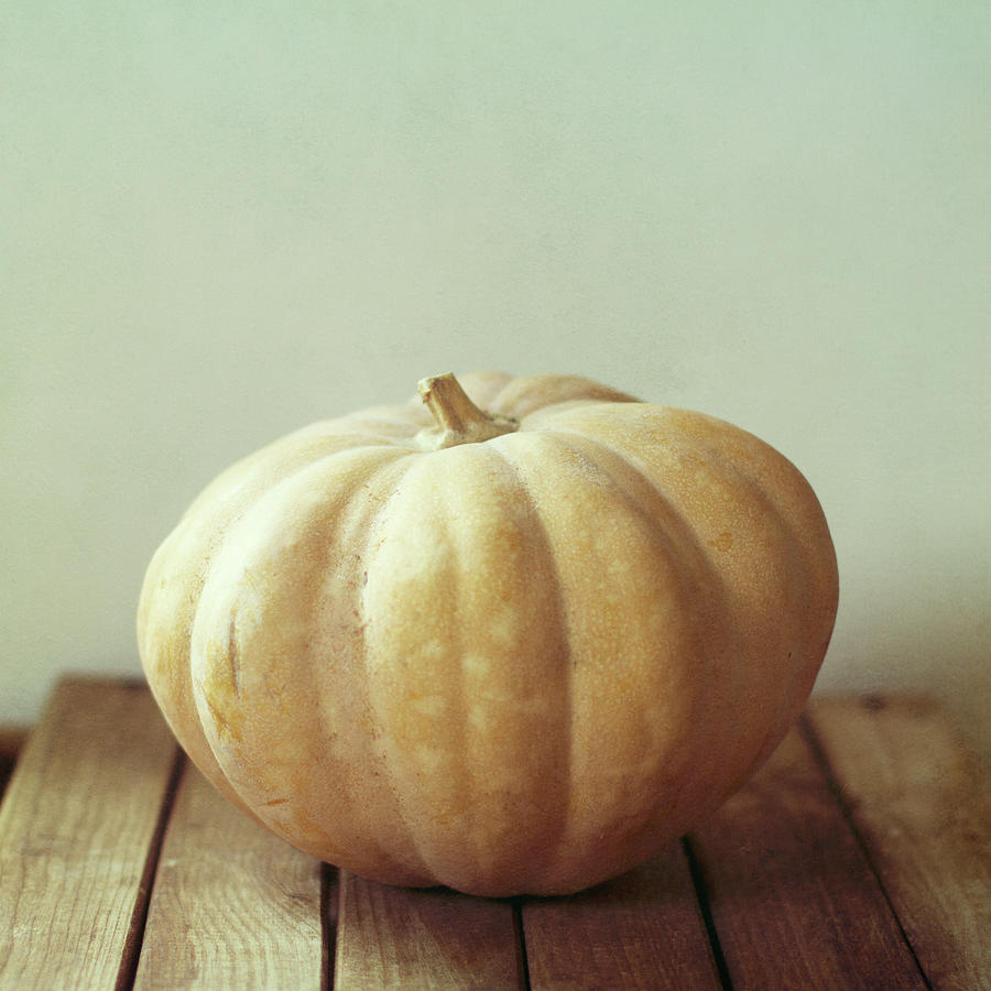 Pumpkin On Wooden Table Photograph by Copyright Anna Nemoy(xaomena)