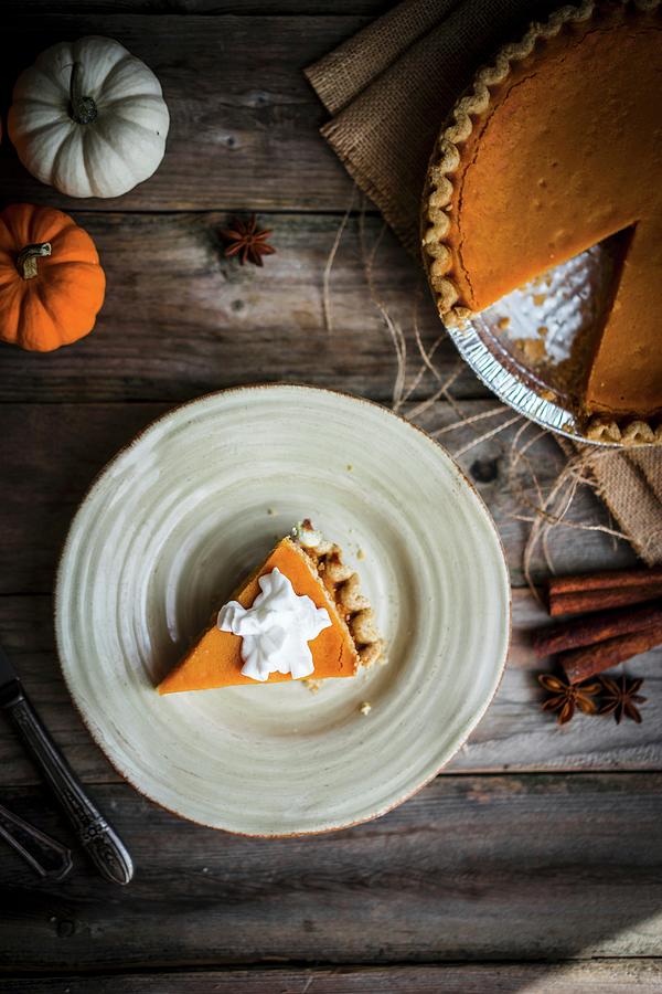 Pumpkin Pie On A Rustic Wooden Surface seen From Above Photograph by Alena Haurylik