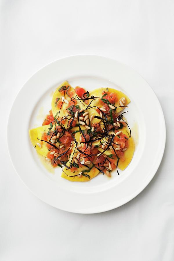Pumpkin Ravioli With Tomatoes And Pine Nuts seen From Above Photograph by Steven Joyce