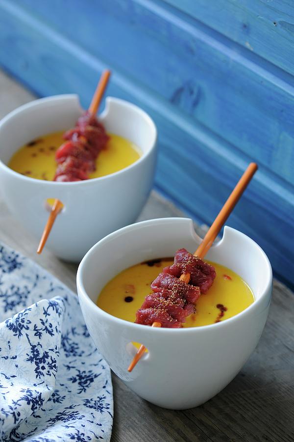 Pumpkin Soup With Beef Skewers Photograph by Antje Plewinski