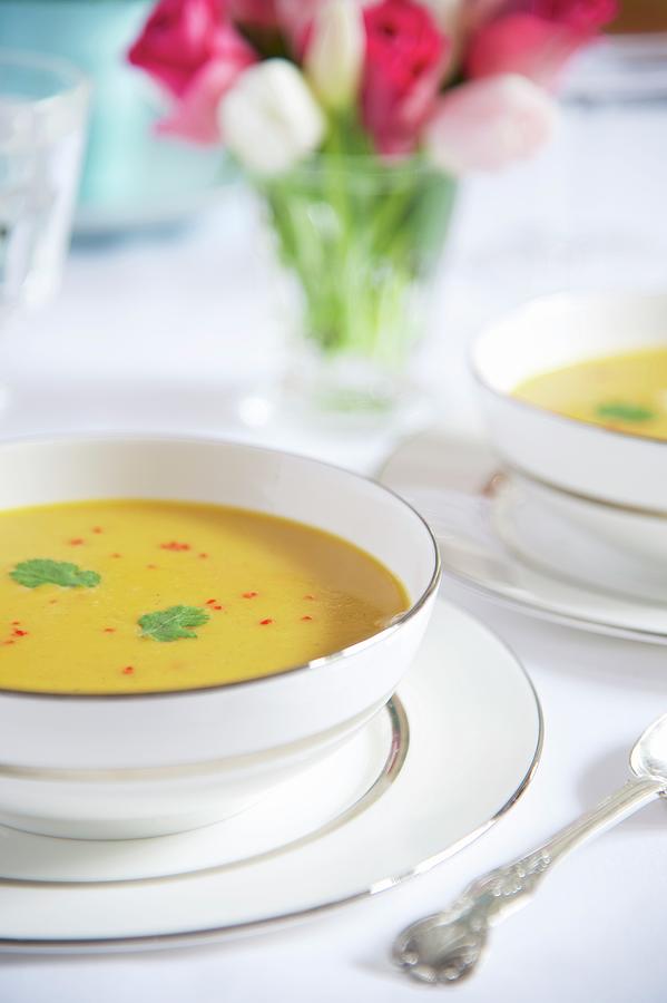 Pumpkin Soup With Chilli And Coriander Photograph by Winfried Heinze