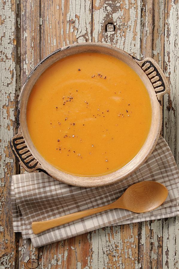 Pumpkin Soup With Pepper Photograph by Jean-christophe Riou