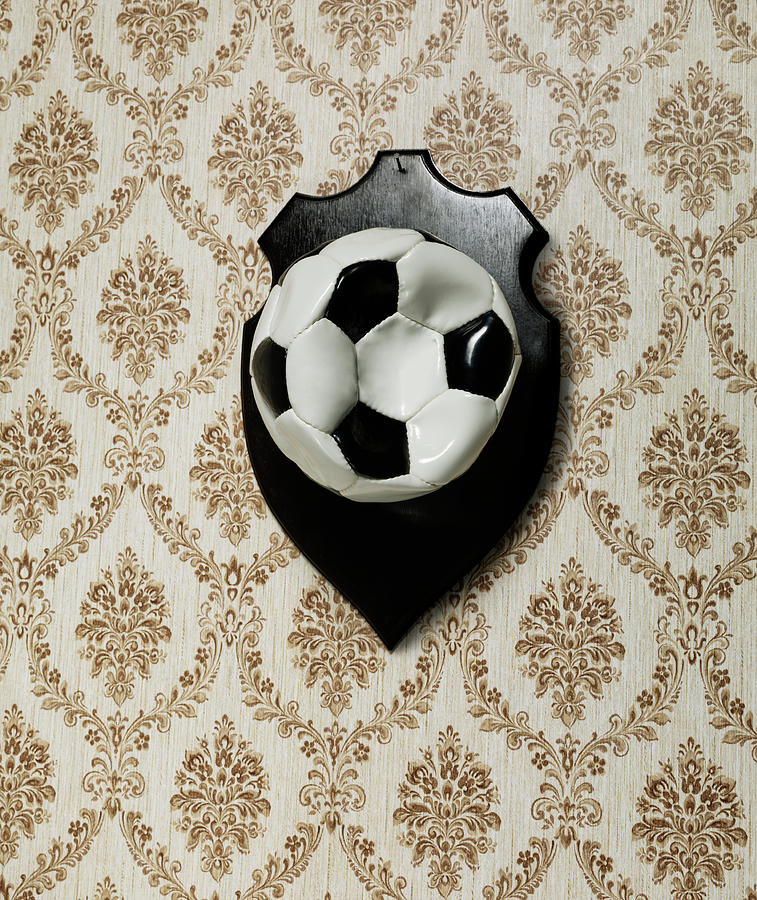 Punctured Football Hanging As A Trophy Photograph by Henrik Sorensen Punctured Football Hanging As A Trophy Photograph by Henrik Sorensen