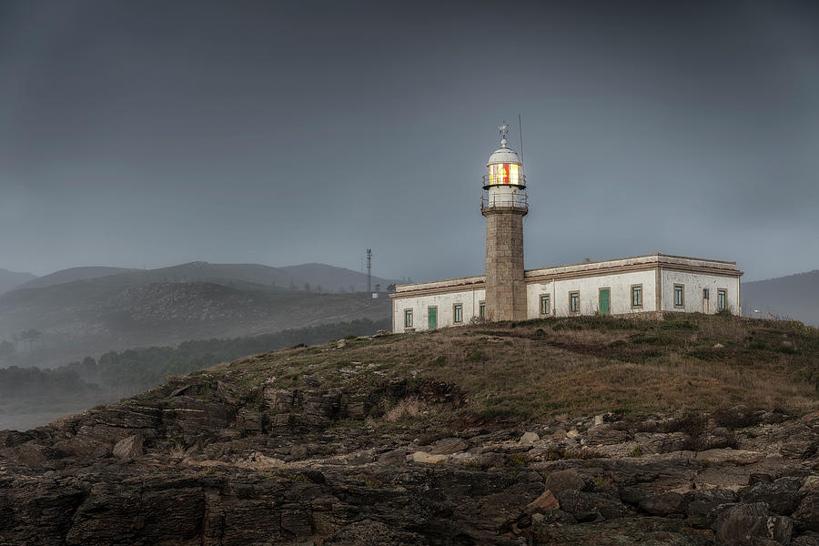 Punta Insua Or Lariño Lighthouse On A Foggy Sunset. Galicia, Spain ...