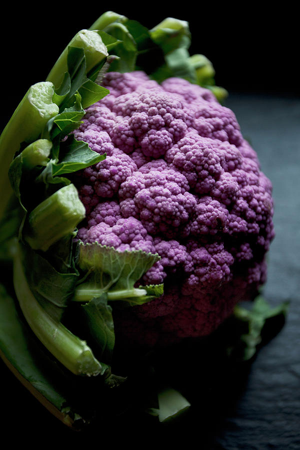 Purple Cauliflower On A Black Slate Countertop Photograph by Ryla Campbell