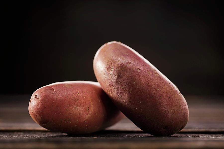 Purple Potatoes Photograph by Christian Schuster