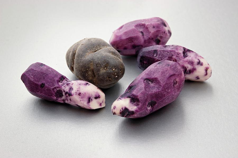 Purple Vitelotte Potatoes, Peeled And Unpeeled Photograph by Petr Gross