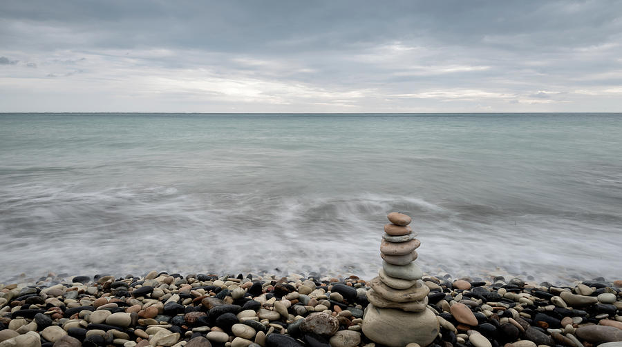 Pyramid Of Balancing Stones , In The Wavy Ocean Photograph