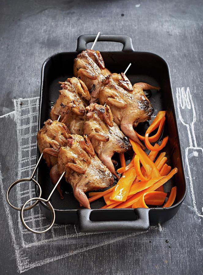 Quails With Garlic And Tarragon Butter With Glazed Carrots Photograph