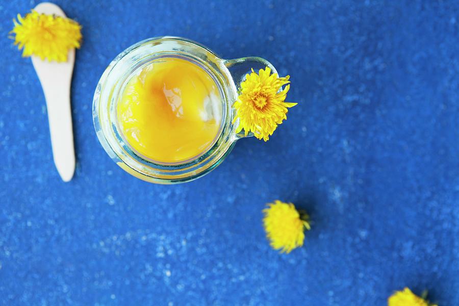 Quark Dessert With Dandelion Sauce In A Jar On A Blue Table Photograph by Nika Moskalenko