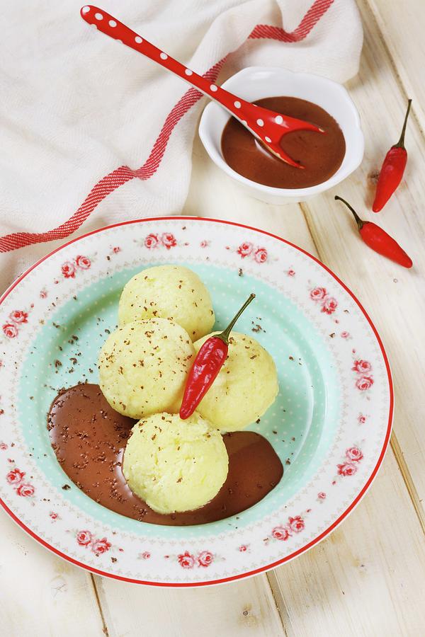 Quark Dumplings With A Chilli And Chocolate Sauce Photograph by Zita Csig