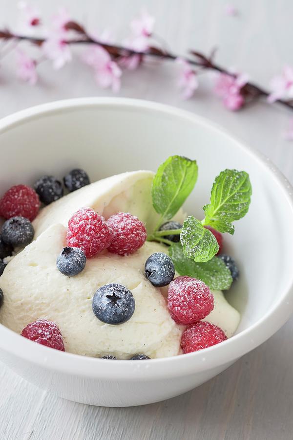 Quark Mousse With Berries, Vanilla Pods And Icing Sugar Photograph by ...