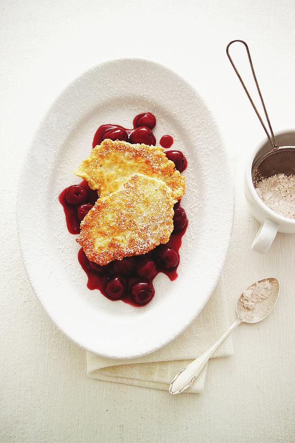 Quark Pancakes On Cherry Sauce Photograph by Michael Wissing