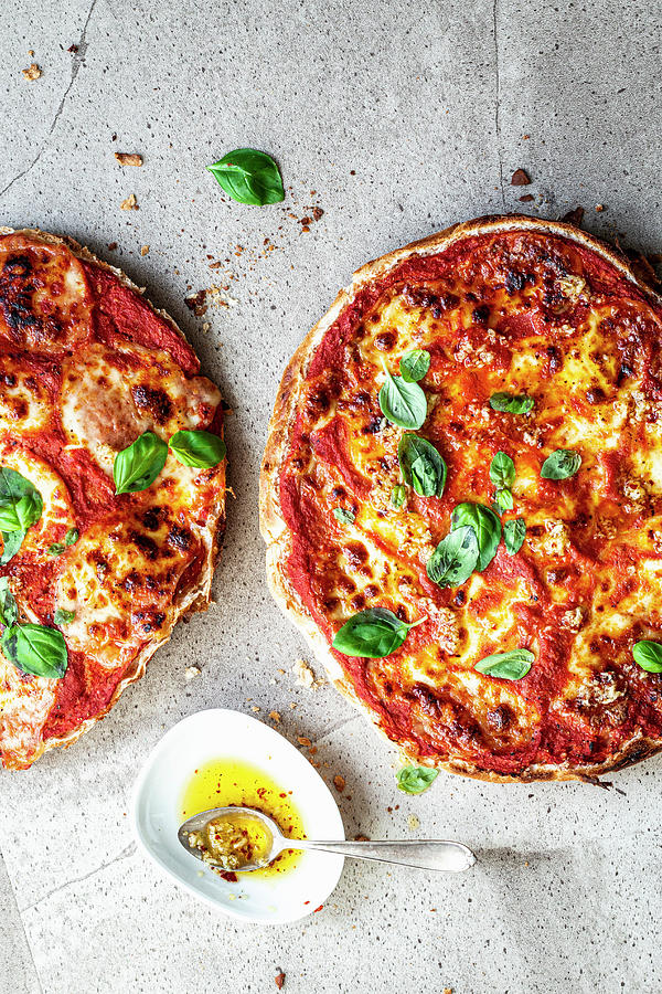 Quick Flatbread Pizzas With Tomato Sauce And Basil Photograph by Simone Neufing