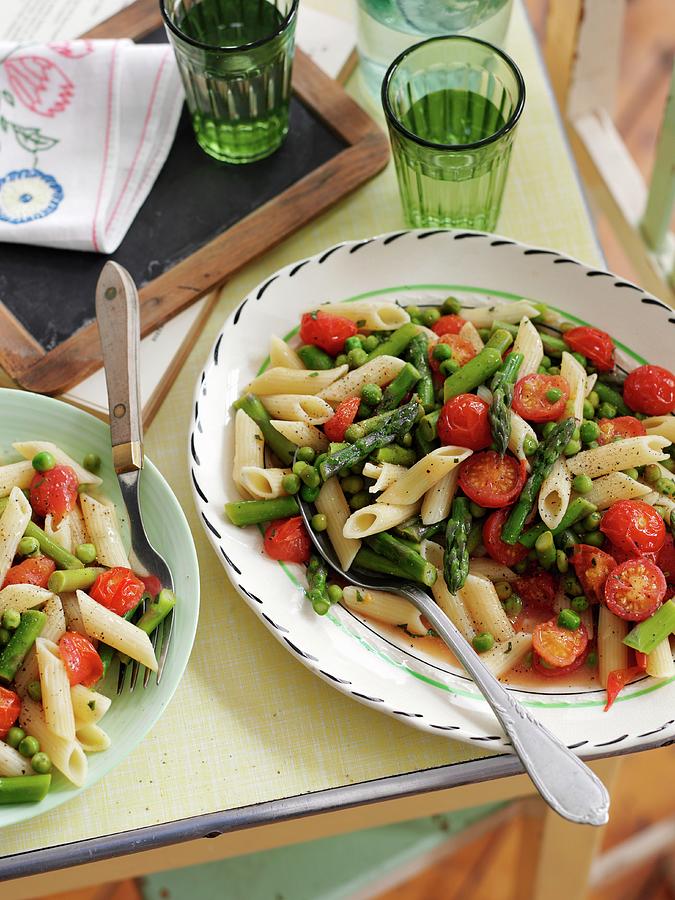 Quick Penne Pasta With Asparagus, Cherry Tomatoes And Peas Photograph by Gareth Morgans