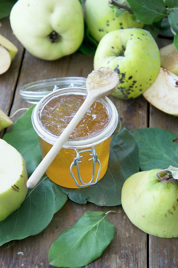 Quince Jam In A Glass Jar And Fresh Quinces Photograph by Martina Schindler
