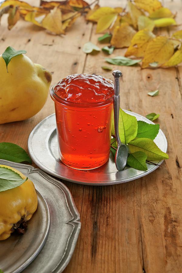 Quince Jelly In A Glass On A Tin Plate Photograph by Atelier Hmmerle