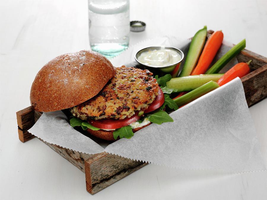 Quinoa And Brown Rice Burger With Tomato And Baby Spinach On A Bun With Vegetable Spears Photograph by Albert P Macdonald