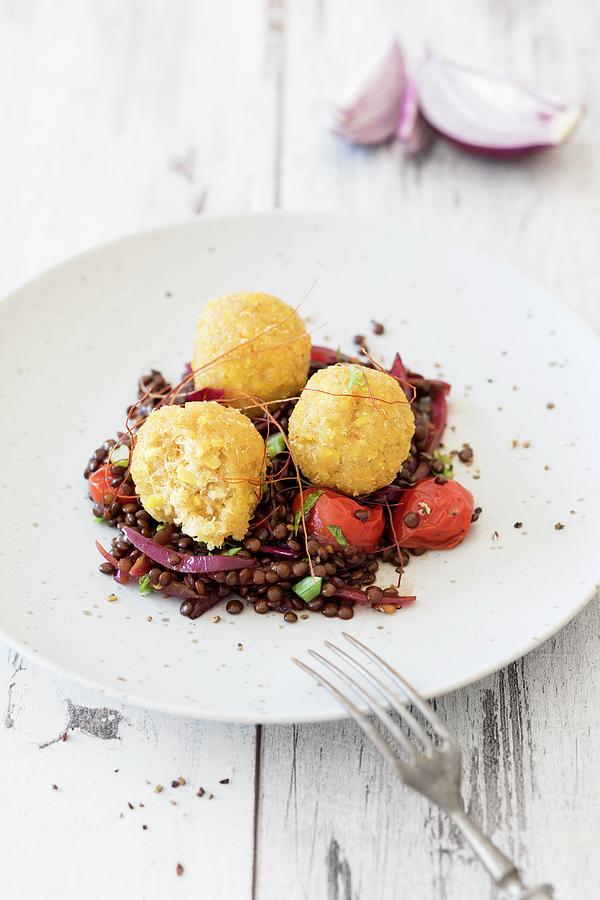 Quinoa And Lupine Balls On A Bed Of Balsamic Lentils Photograph by Jan Wischnewski