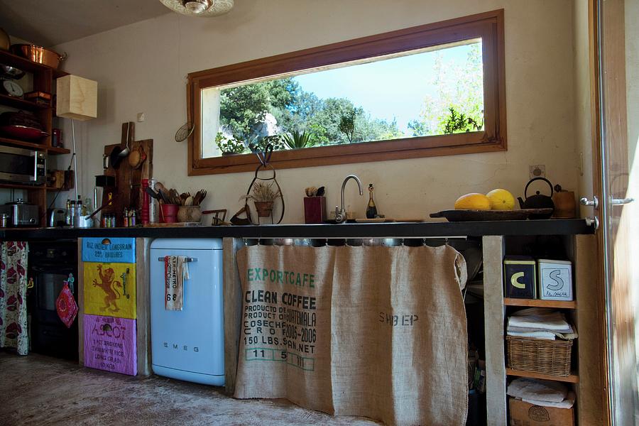 https://images.fineartamerica.com/images/artworkimages/mediumlarge/2/quirky-kitchen-counter-with-coffee-sack-curtains-and-hand-made-doors-christophe-madamour.jpg