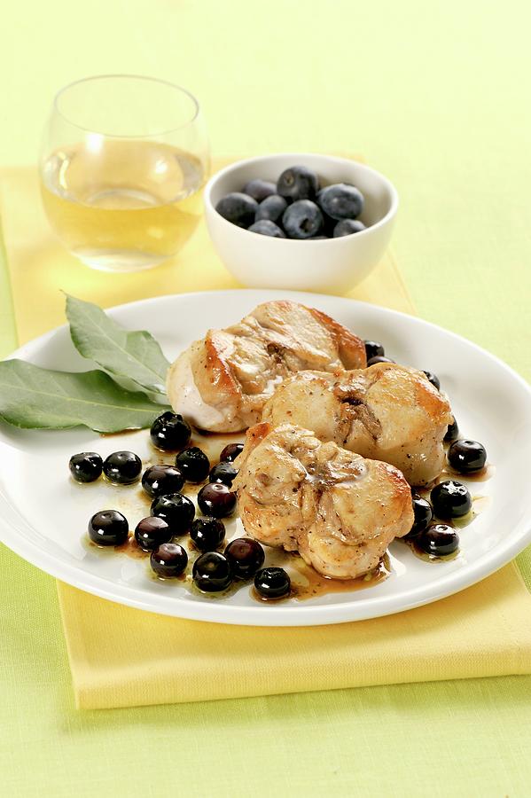 Rabbit With Olives And Blueberries Photograph by Franco Pizzochero