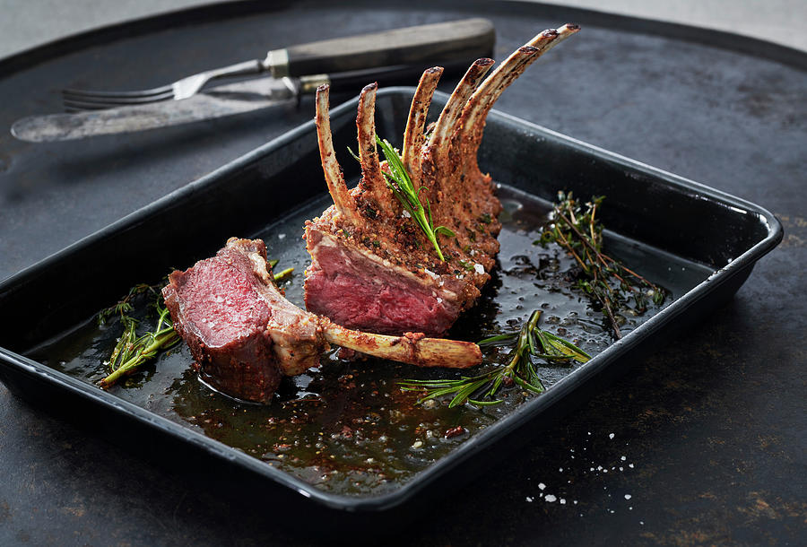 Rack Of Lamb In A Black Baking Tin Photograph by Stefan Schulte-ladbeck
