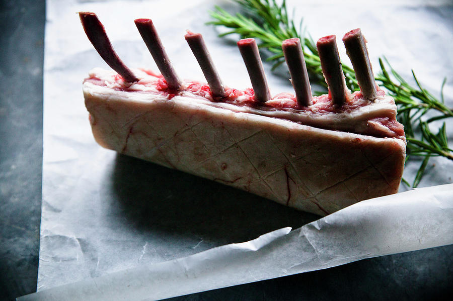 Rack Of Lamb On Greeseproof With Rosemary Pre Cook Photograph by Karen Thomas