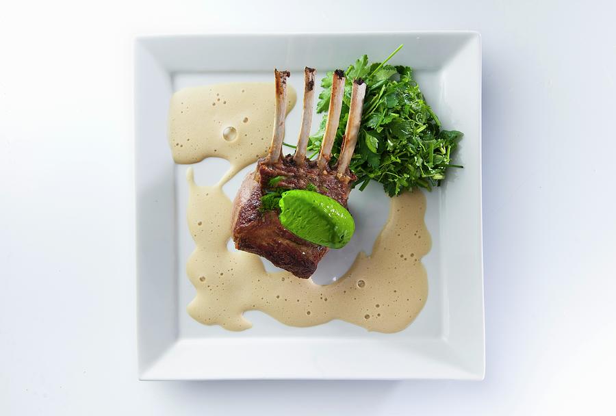 Rack Of Lamb With A Guinnes Foam Sauce And Mushy Peas Photograph by Christophe Madamour