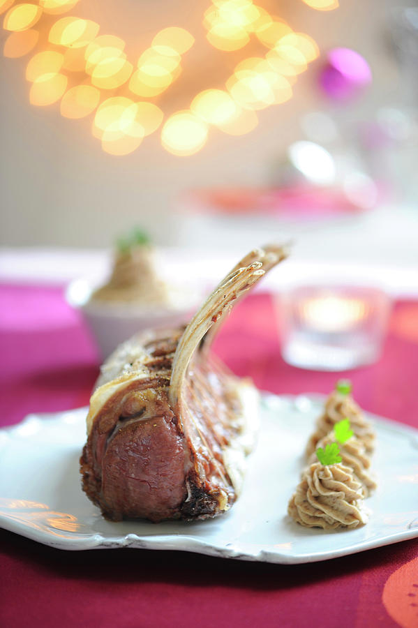 Rack Of Young Wild Boar And Chestnut Puree With Herbs Photograph by Schmitt