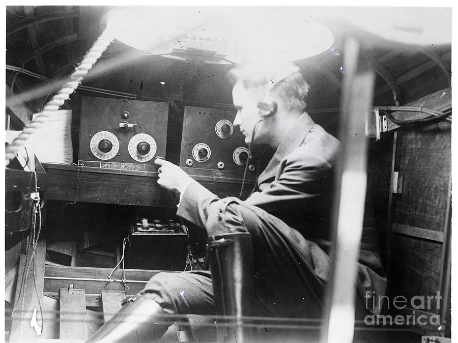 Radio Operator Turning Radio Photograph by Bettmann