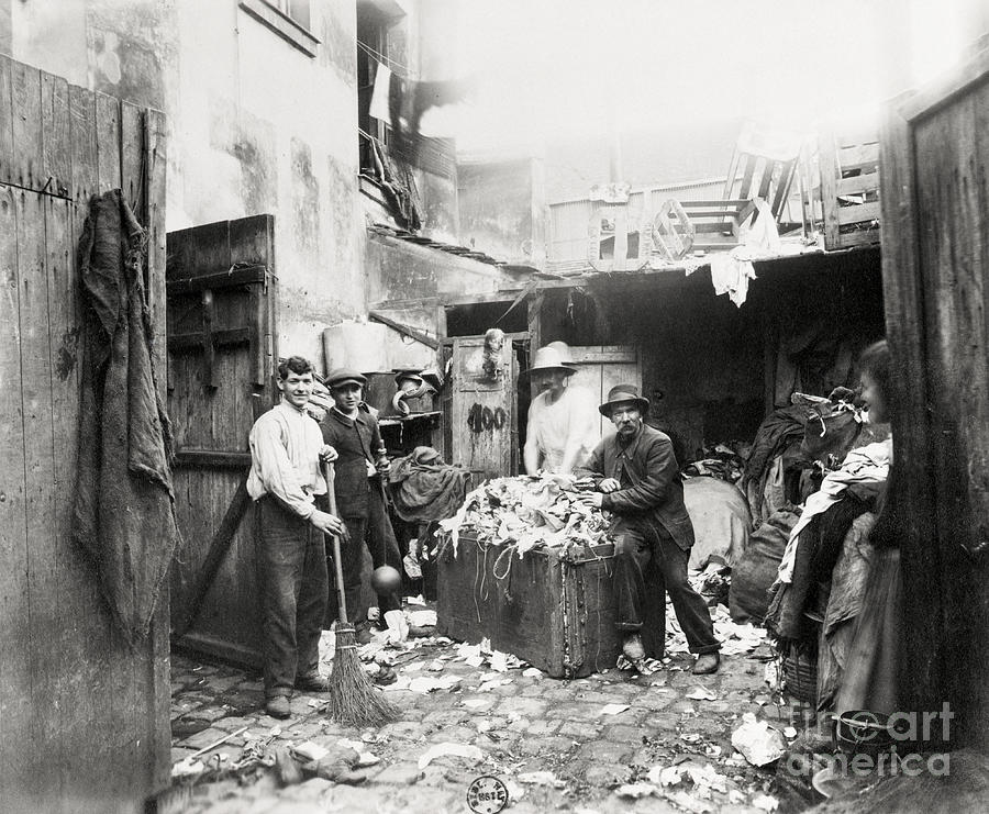 Rag Dealer Posing By Wares In Alley Photograph by Bettmann