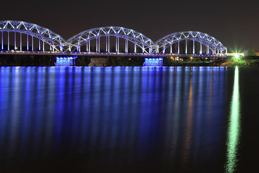 Transportation Photograph - Railway Bridge crosses the Daugava river in Riga Latvia at night by Andis Atvars