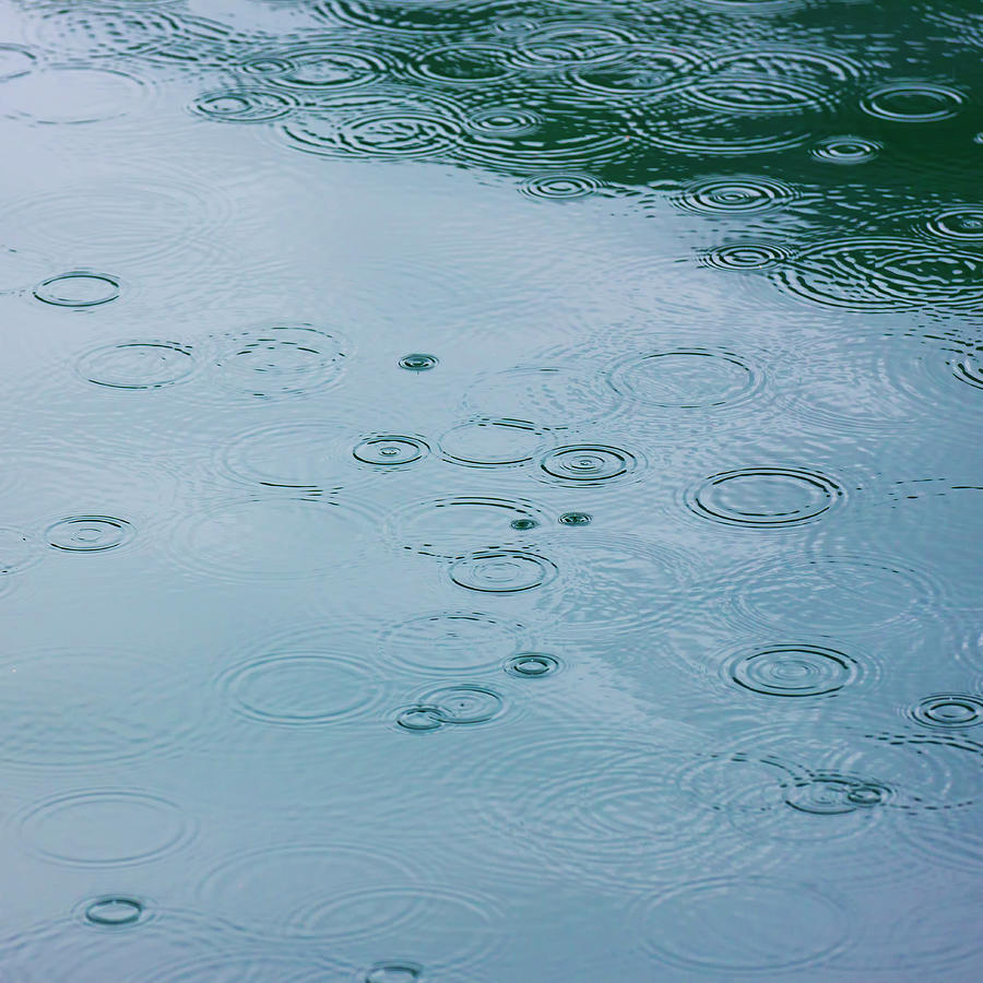 Rain Drops And Water Ripples Photograph by Arctic-images
