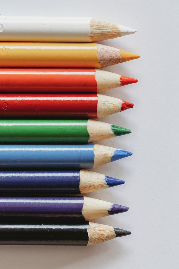 Crayon Photograph - Rainbow Of Coloring Pencils On Plain White Background by Cavan Images