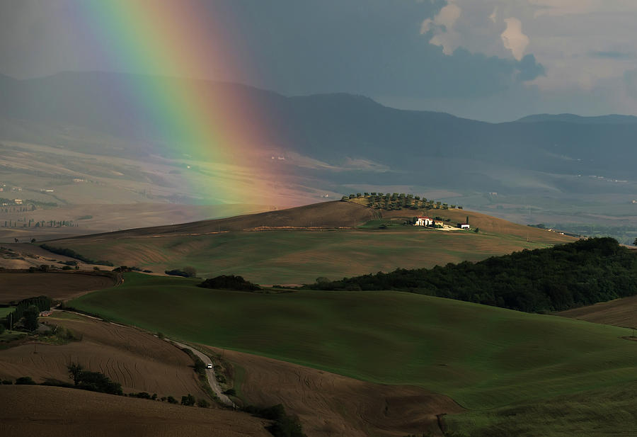 Rainbow over val DOrcia Photograph by Jaroslaw Blaminsky