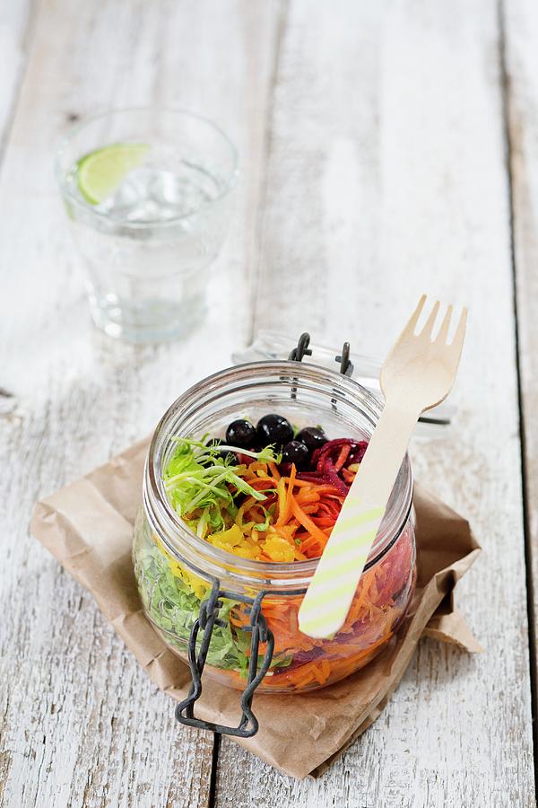 Rainbow Salad In An Open Glass Jar With Beetroot, Carrots, Yellow Pepper, Lettuce And Blueberries Photograph by Tina Engel