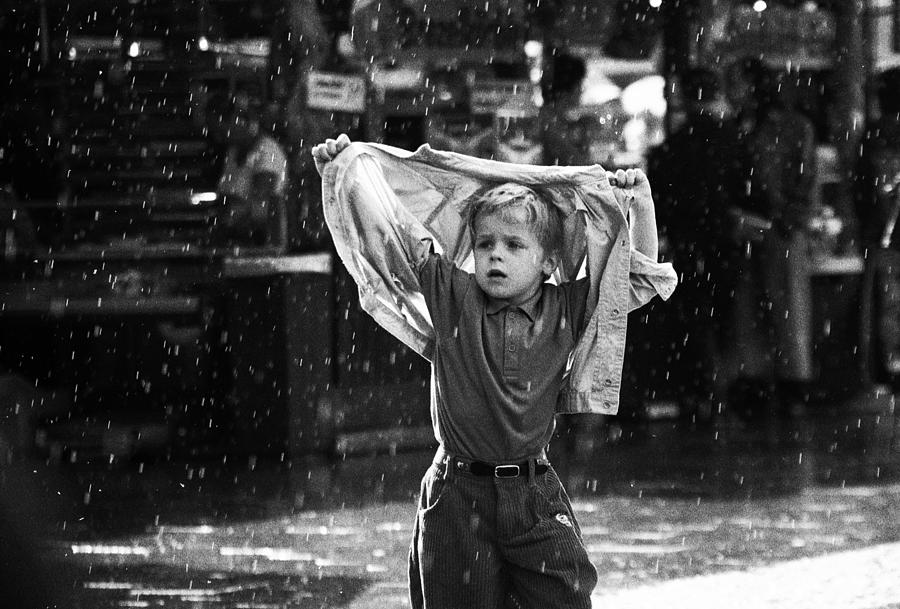 Black And White Photograph - Raindrops Keep Falling On My Head (from The Series "childhoods") by Dieter Matthes